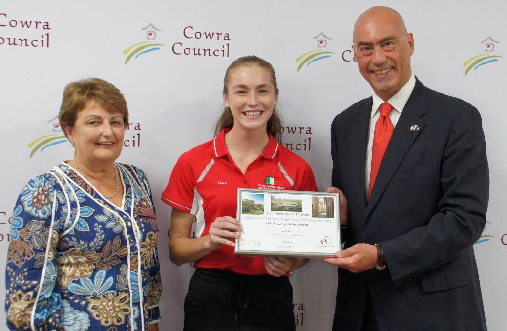Cowra Shire Council Mayor, Ruth Fagan, Cowra Youth Councils Laura Price and Italian Amabassador to Australia, Paolo Crudele presenting Laura with a certificate of achievement at the festival.