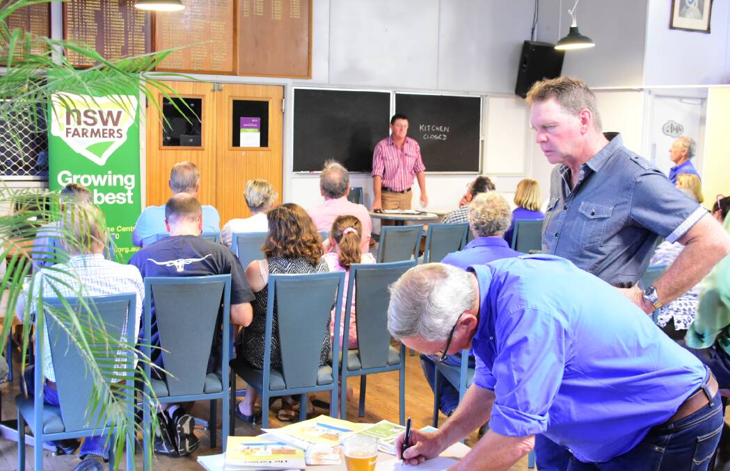NSW Farmers vice president Chris Groves addresses farmers at a meeting in Woodstock this week wanting more information about mine exploration in the district.