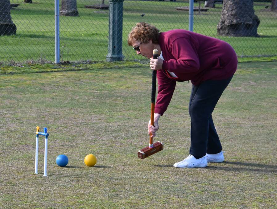 Anna Kusetic lines up a shot at croquet. On Wednesday Anna teamed with Jenny Walker against Helen Bryant and Maria Buturac.