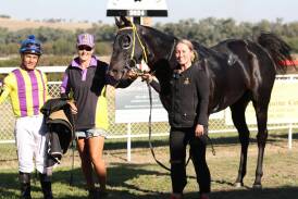 Winning jockey Leandro Ribeiro, winning trainer Connie Greig, and strapper Amber Collins with Grenfell Picnic Cup winner Valadyium. Image: Jeff Hanson/NSW Country and Picnic Racing