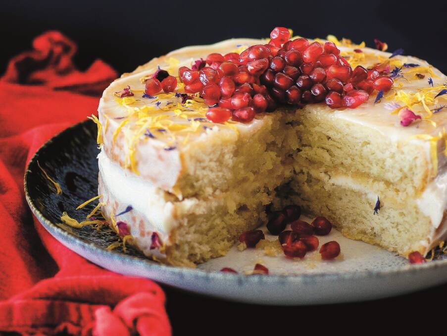 Vegan vanilla sponge cake with cream "cheese" icing, maple and pomegranate. Picture: Katrina Meynink