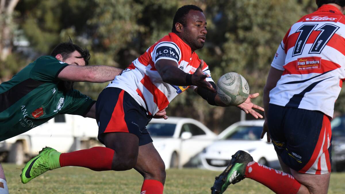 DISHING OFF: Cowra centre Vili Koilagi offloads on Saturday, the Eagles fought hard but were overrun by Emus. Photo: JUDE KEOGH