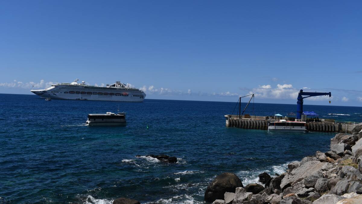 Passengers from a cruise ship are shipped ashore at Cascades Pier.