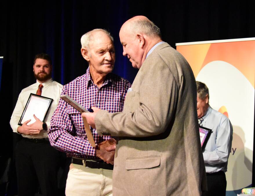 Arthur Hogan is congratulated by Cowra's Australia Day Ambassador, Terry O'Connell. Photo: Kelsey Sutor 