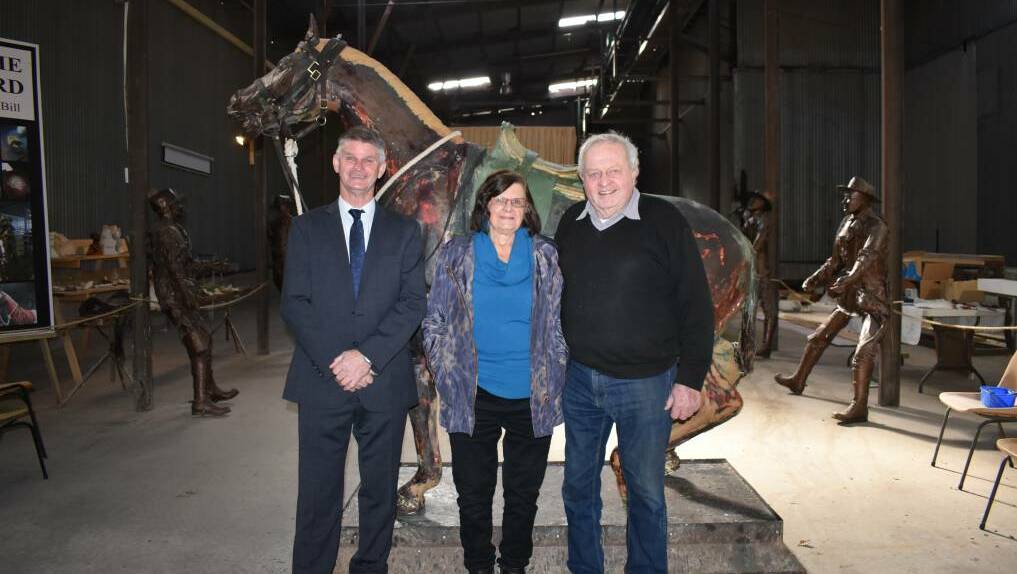 Hilltops Mayor Brian Ingram with Carl and Fay Valerius. Carl has made a life size statue of “Bill the Bastard”. Photo: Harden Murrumburrah Express