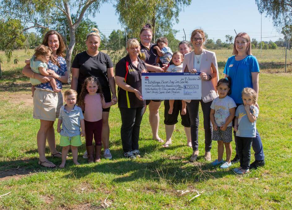 Steph Cooke presents a cheque to staff, children and their families from Yalbillinga Boori Day Care Centre. Photo supplied. 
