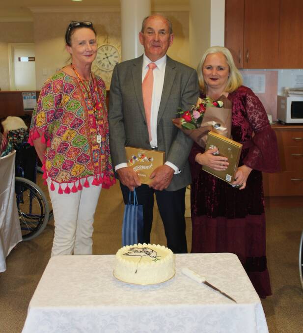 Weeroona's Jan Harper, Cowra Mayor, Councillor Bill West and Carolyn Horsey, who made the cake for World Peace Day. 