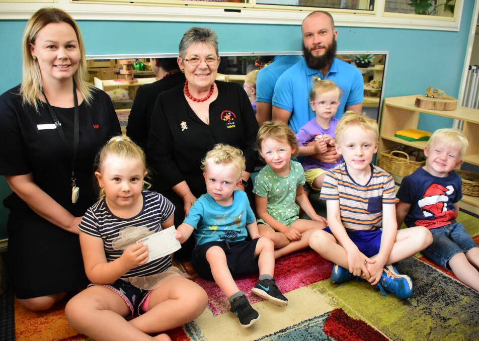 Adelaide Lawrence from Westpac's Cowra Branch with Deidre Healy, Peter Buik and children from Cowra Early Childhood Services. 