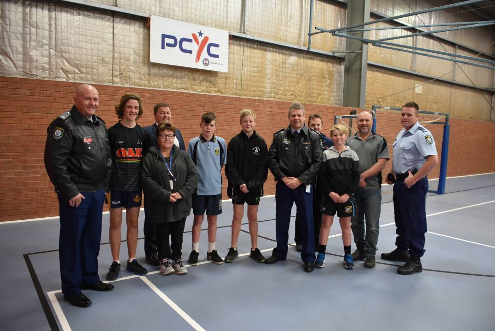 Representatives from PCYC along with local staff, police and school students. 