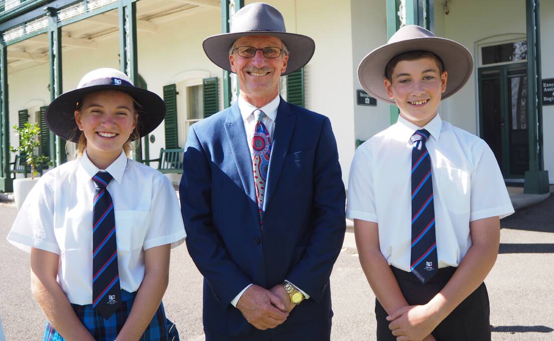 Scots All Saints College headmaster David Gates [centre] with last year's middle school captains Emily Brown and Zane Newham. Photo: SAM BOLT