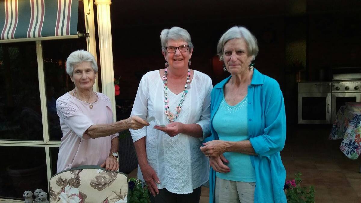 President Heather Kiely presenting a cheque for $1000 to Lesley Cummings and Anne Jefferey from Cowra Riding for the Disabled. 