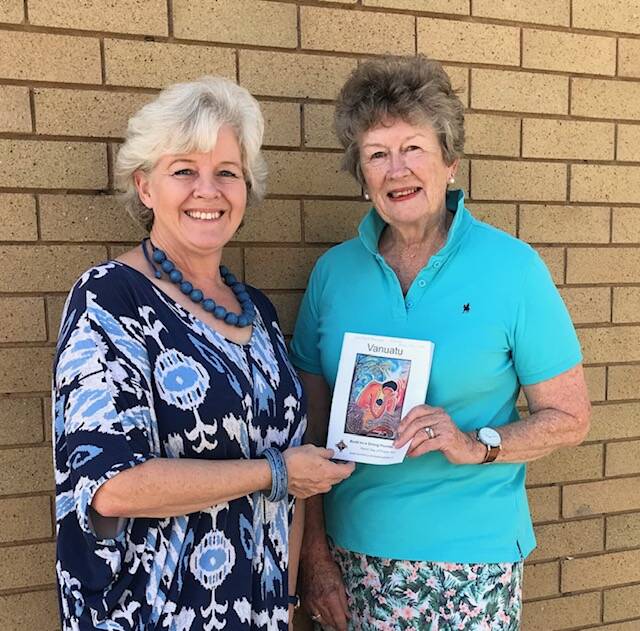 Penny Simpson and Rowena Casey holding a program for this year's World Day of Prayer. Photo supplied. 