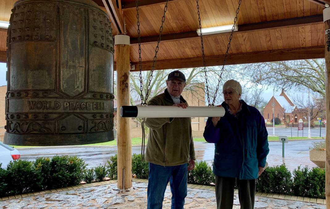 Chairman Ian Brown and committee member Margaret Britton ring the bell. 