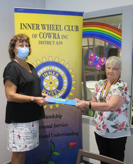 Fiona Carson being inducted by Inner Wheel Club of Cowras President Diane Walsh. 