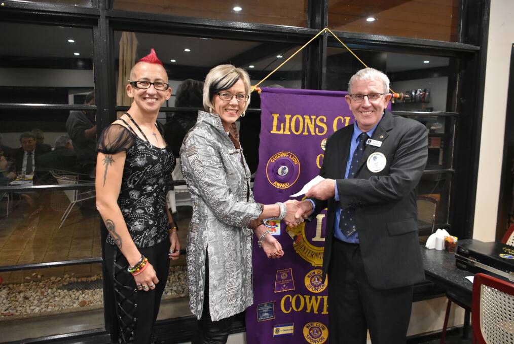 Hell Horton and Fran Stead from CINC receiving a donation from Cowra Lions Club President Ian Acret. 