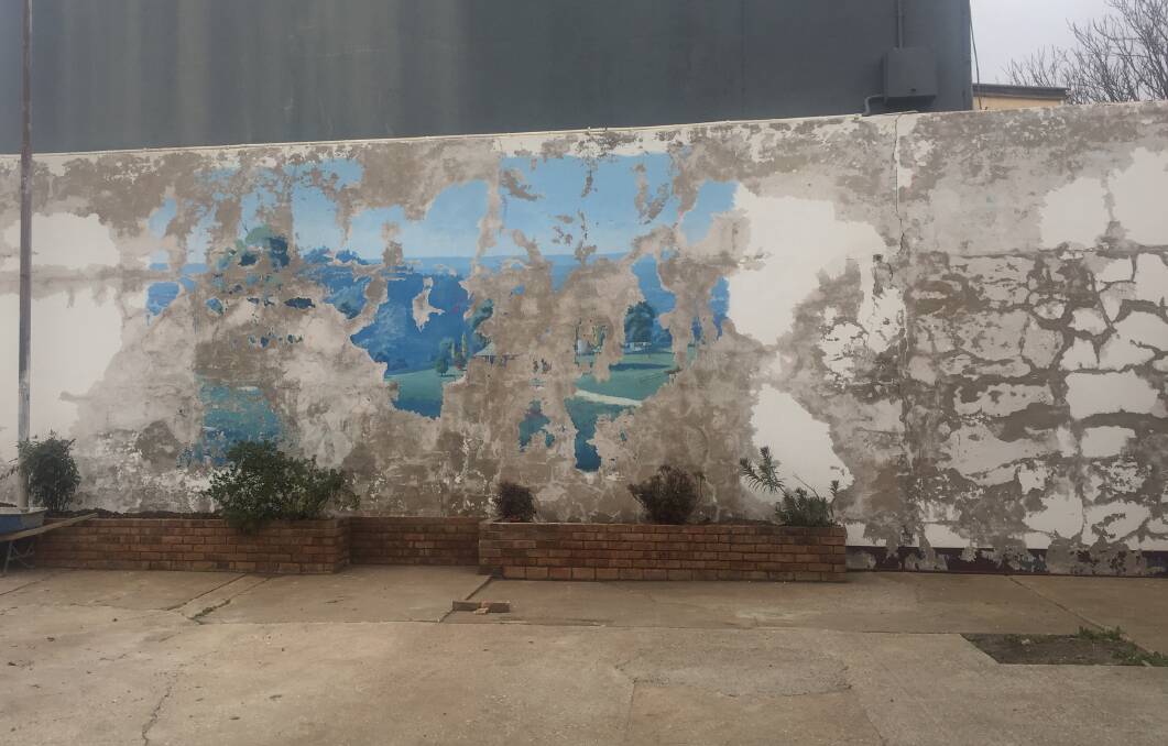 The old mural suffered extensive water damage. 