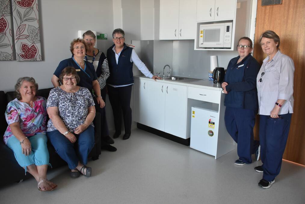 Trish Graham, Jenny Friend, Aileen Ferguson, Sue Perkins, Pauline Rowston, Megan Gumbleton and Coral Larsen in front of the new kitchenette. 