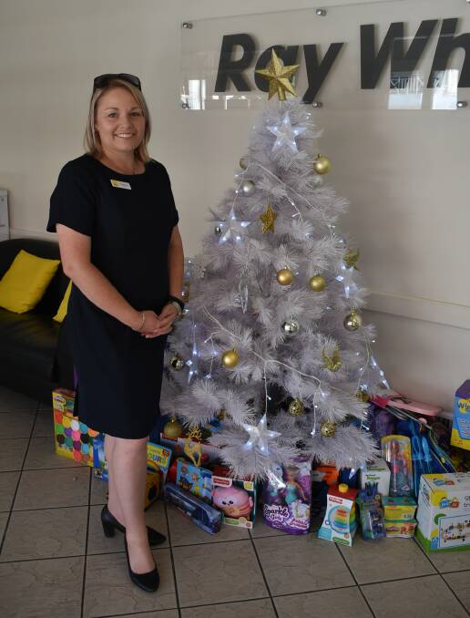 Katie McVicar from Ray White Cowra with their giving tree. 