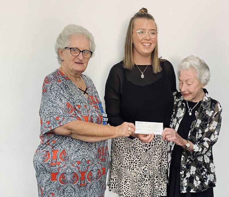 Grace accepting her cheque from treasurer Mrs Margaret Hennessy and Mrs Isobel Bensley OAM earlier this year. 