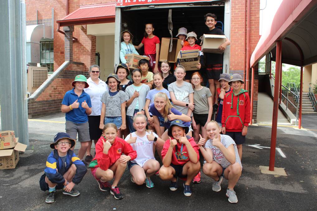 Cowra Public School students with Major Cathryn Williamson (left, second row) from Cowra Salvation Army. 