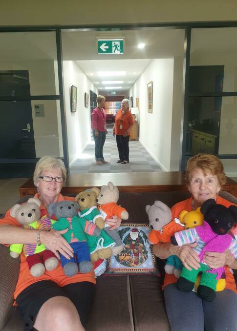 Volunteers Mary Jo Weston and Rose Middleton with some of the adorable teddy bears made by Cowra resident Shirley Flint.