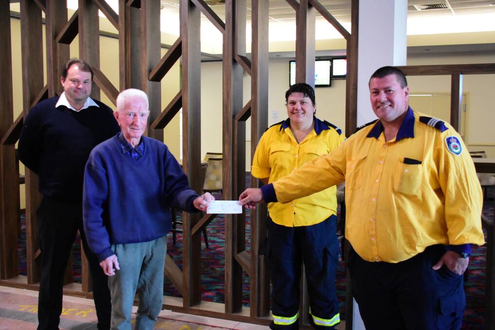 Cowra Bowling Club manager, Marc Eisenhauer and President Norm Egan with Karina Russell and Jason Ambachtsheer from Waugoola RFS. 