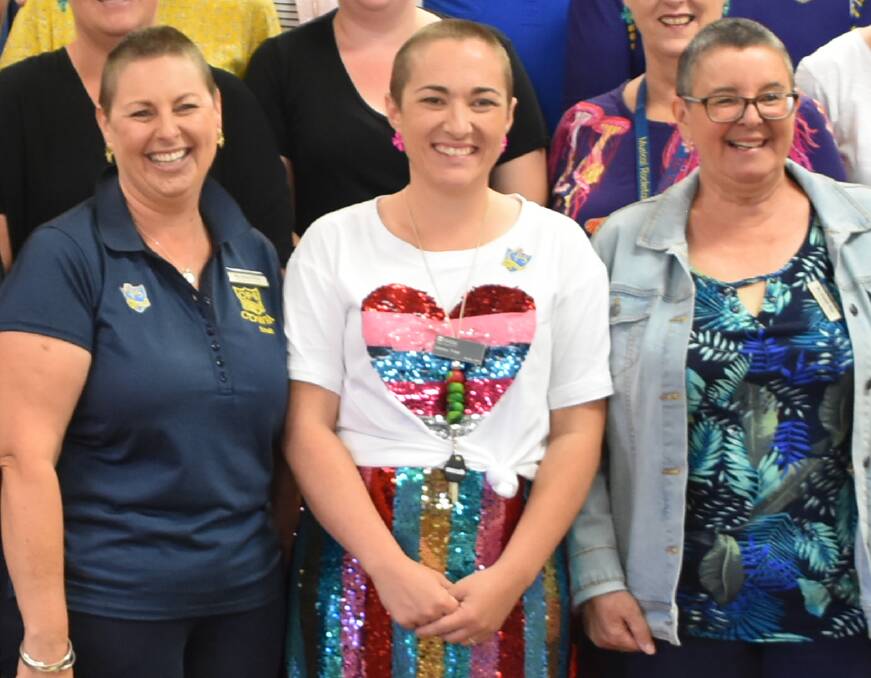 Teacher Emma Tree (centre) after Cowra Public School's World's Greatest Shave earlier this year. 