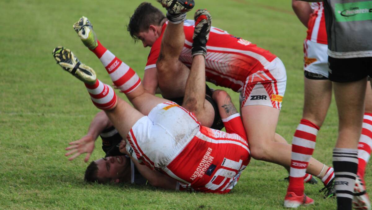 Mitch Browne gets taken to ground during Cowra's loss against Mudgee at Glen Willow Stadium on Sunday.