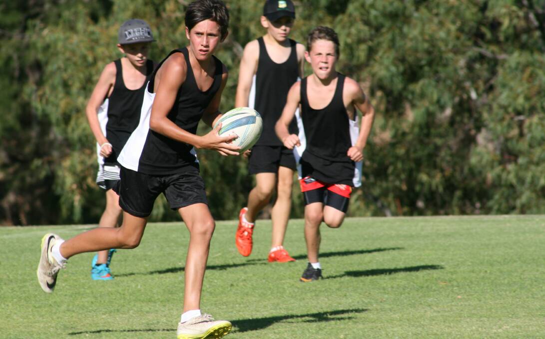 Charlie Jeffries on the attack for team Zibara last season during the PCYC's touch football season.