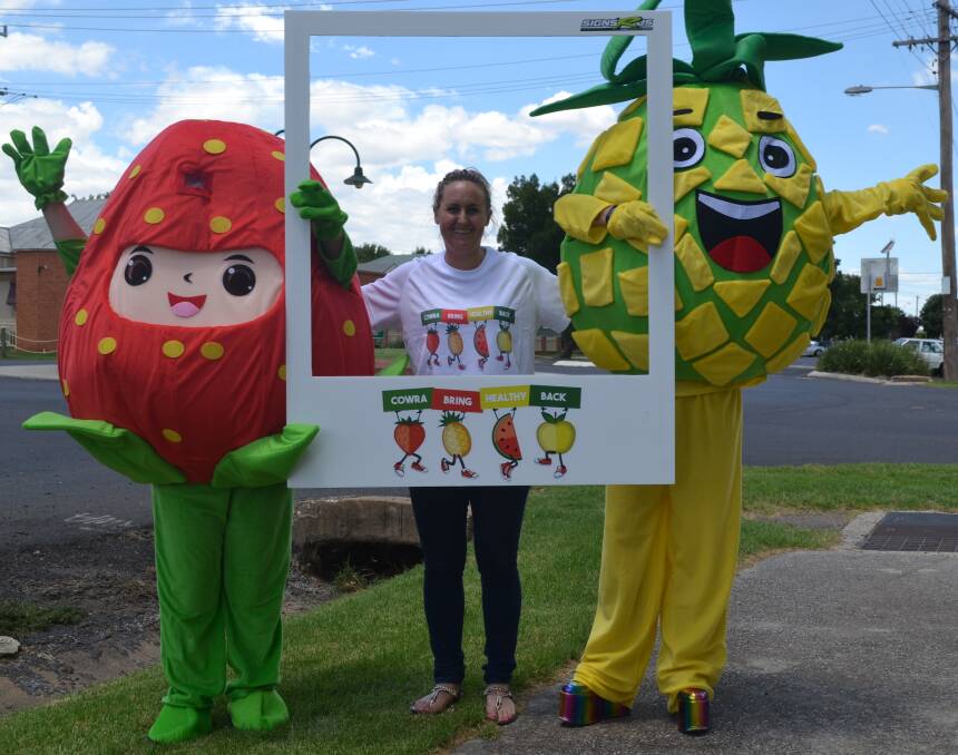 Bring Healthy Back steering committee president Tabitha Jones with Pineapple Helen Horton and Strawberry Marion Speechley.