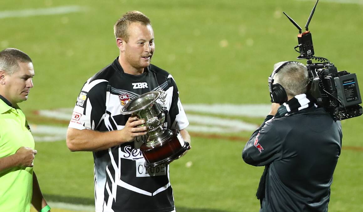 Cowra Magpies captain Josh Rainbow with the Chad Nealon Memorial Cup earlier this season. Photo: Phil Blatch