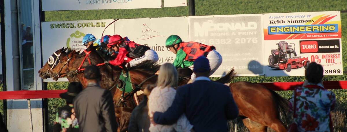Punters cheer home a winner during Young Turf Club's Young Cup meeting in 2019. 
