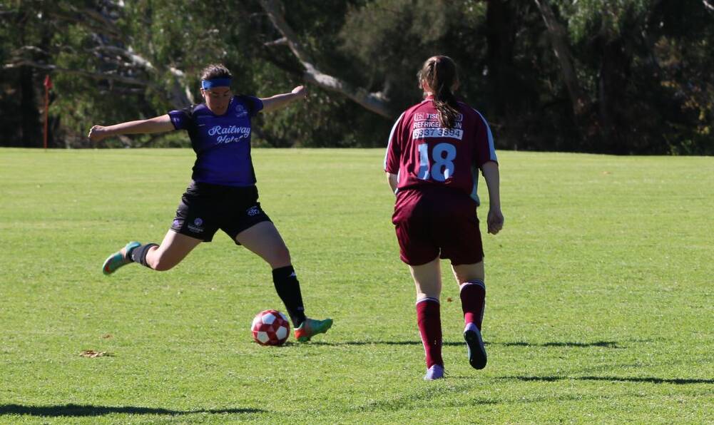 Jessica Hing clears the ball out of trouble in a game earlier this season. The Eagles ladies take on Macquarie United this Sunday.