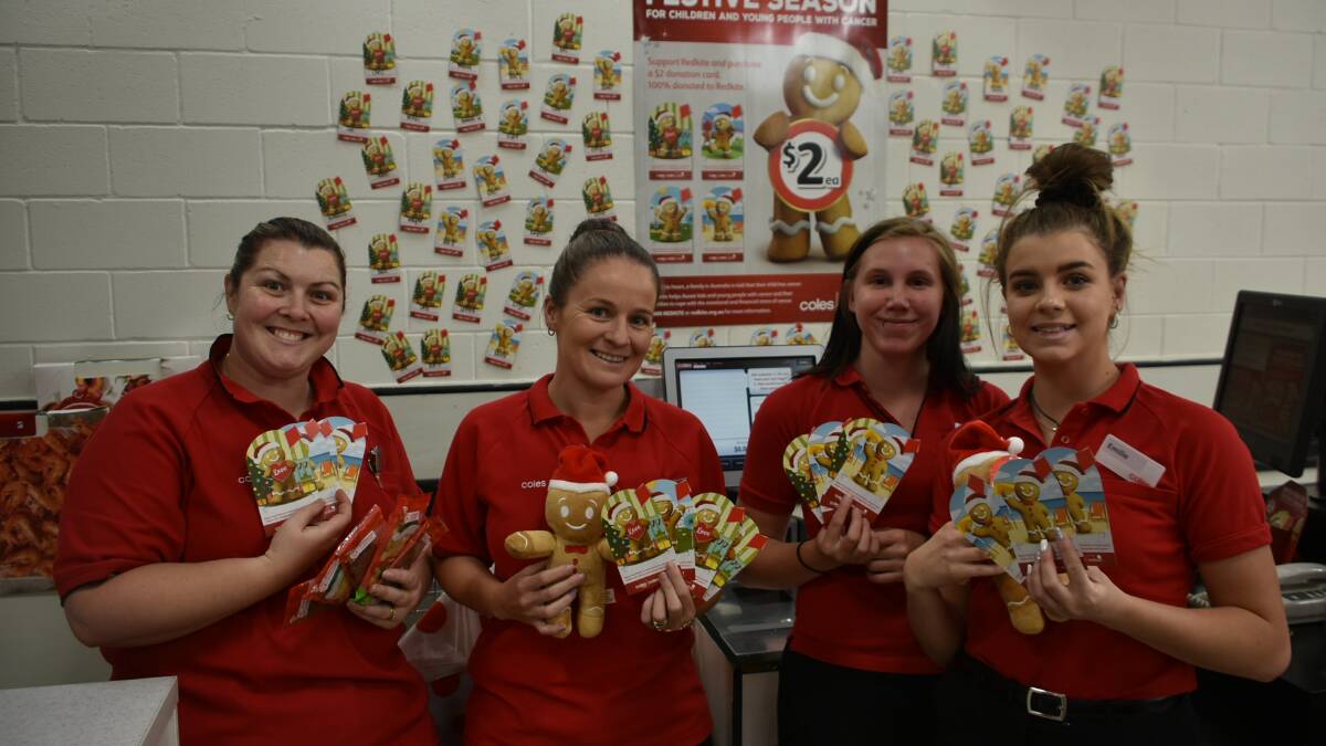 Team members Amy Cremona, Nadia Cherry, Tameka Riley and Emillie Browne show off the Redkite Christmas products available at Coles Cowra.