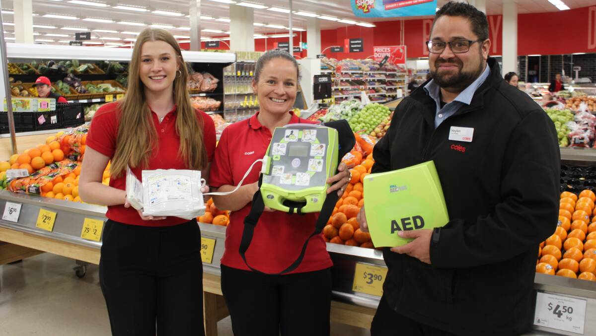 Team members Eliza Braddon, Nadia Cherry and manager Heylen Waqavesi with the new Automated External Defibrillator.