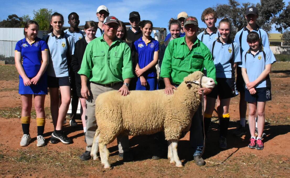 Clint Cole, Greg Hamilton and Hammo the ram with Cowra High School agricultural students.