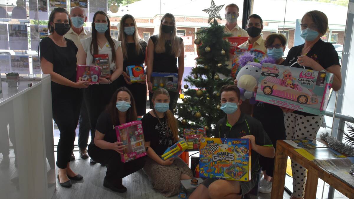 The Ray White Emms Mooney and CINC teams with just some of the gifts donated.