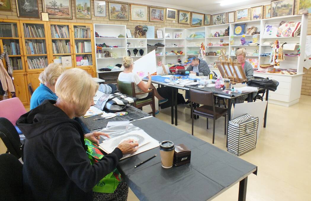 Some of the Monday Artists hard at work preparing for their mini-exhibition in the Visitors Centre until the end of May.