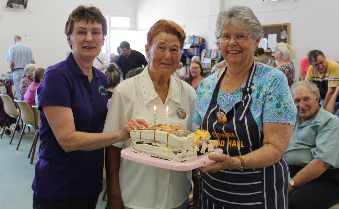Kathryn Tindall, Barbara Sheppard and Libby Balcombe enjoy a slice of the Food Hall's birthday cake.