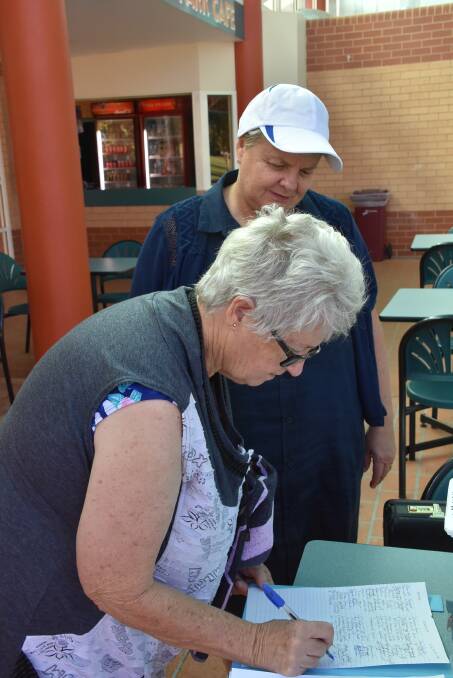 Aqua MIPs members keenly signed the petition on Friday morning.