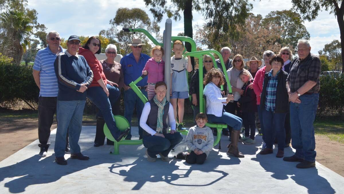 Gooloogong residents gather around their new exercise equipment. 