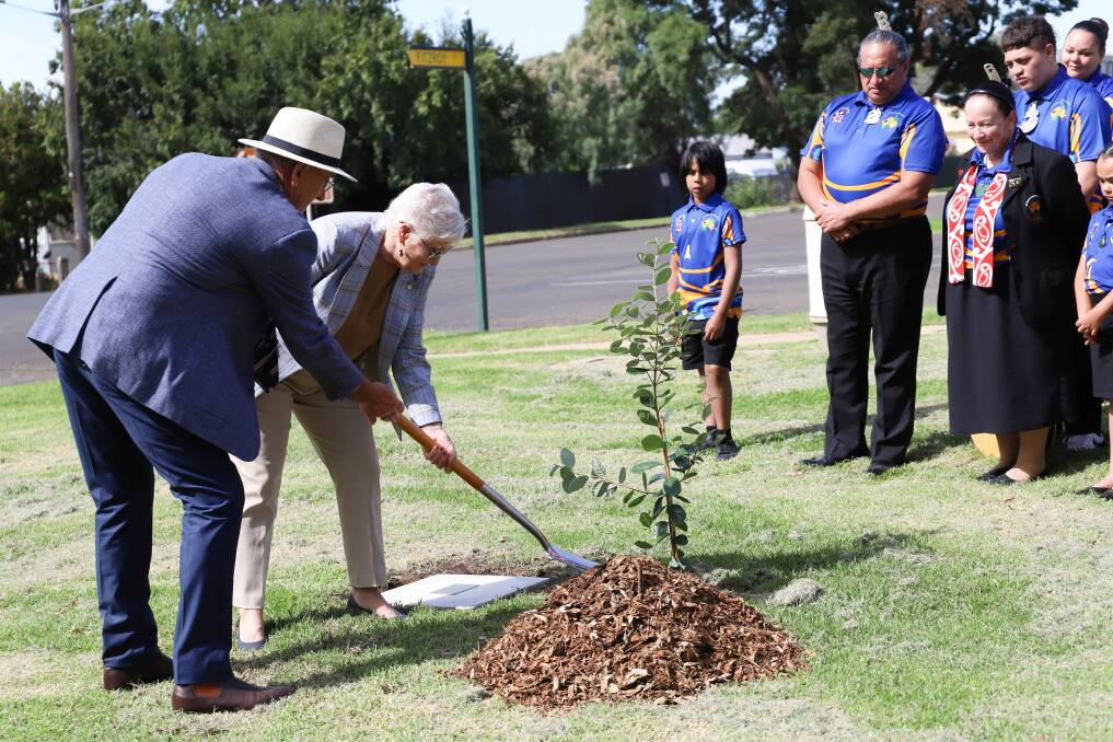 Cowra mayor Bill West and New Zealand High Commissioner Dame Annette King planting a tree in Brougham Park as part of the 2021 Festival of International Understanding.