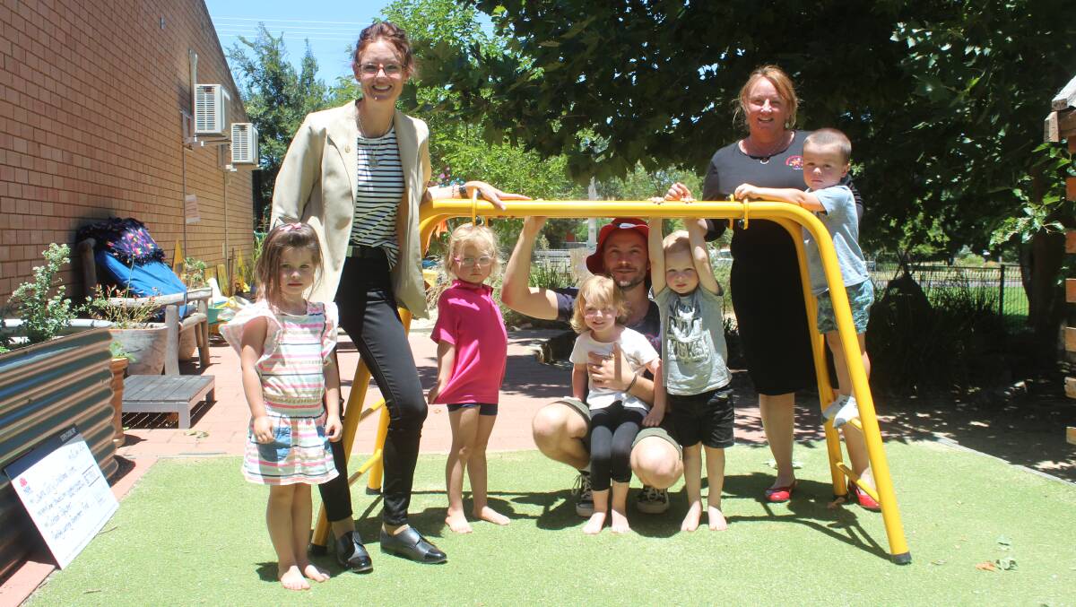Member for Cootamundra, Steph Cooke, Peter Buik, Susan Callaghan and some of Carinya's kids check out the new monkey bars bought with the funding.