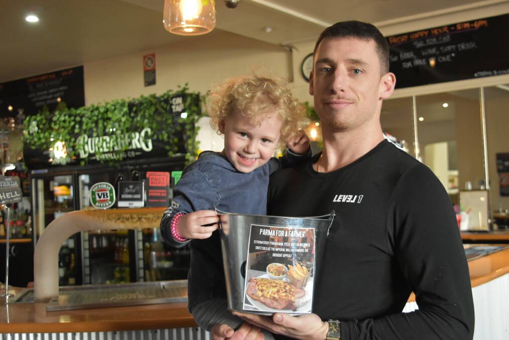 Richard Morgan, with daughter Franky, is encouraging everyone to get behind the Parma for a Farmer drive by purchasing a parmigiana when visiting the Imperial Hotel. 
