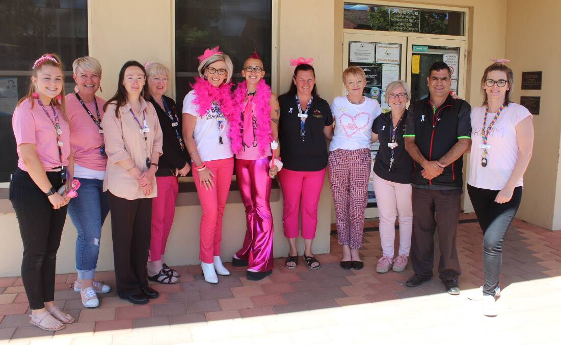 The CINC team during the fundraising morning tea in their pink outfits.