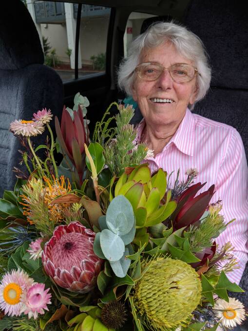  Iris Morgan after being presented with her vase of flowers.