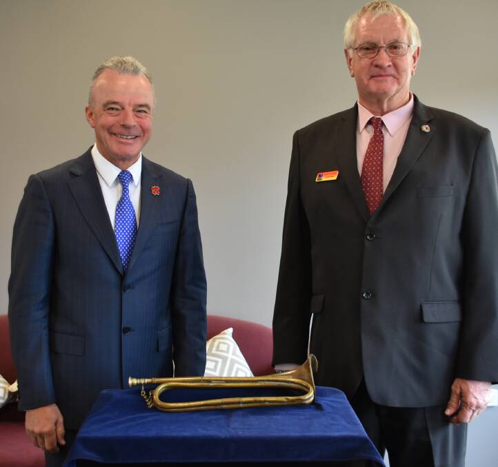 Dr Brendan Nelson and Gordon Rolls with the bugle used by Hajime Toyoshima to signal the beginning of the Cowra breakout.