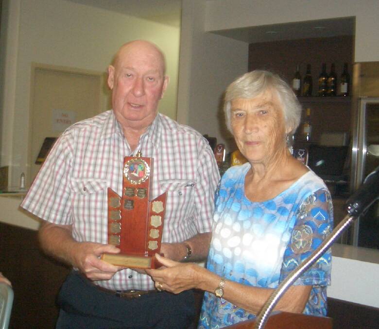Bert Newcombe accepting first prize and the trophy on behalf of Aqua Therapy 1 table at last year's Annual Great Seniors Trivia Challenge.