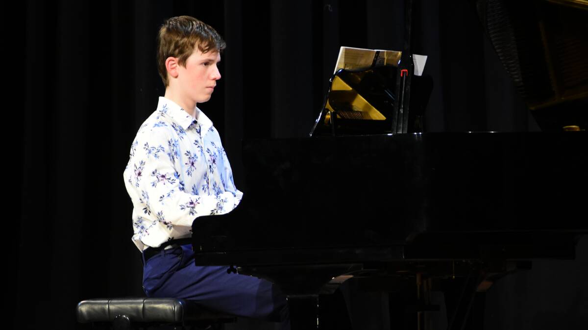 Cowra's Samson Miller performing in the 14 years and under Australian composition piano solo section.