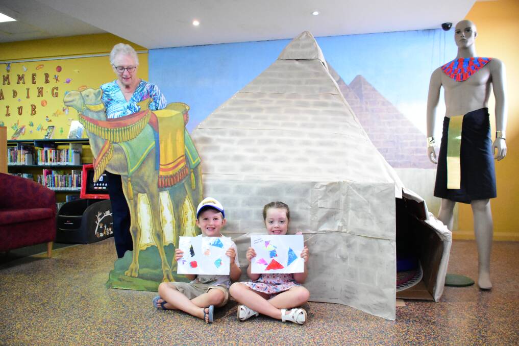 Cowra Library volunteer Jan Ellis with James Coffee and Madeleine Margo at the pyramid for Summer Reading Club. 